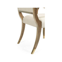 Leg detail on dining armchair, modern high back design.