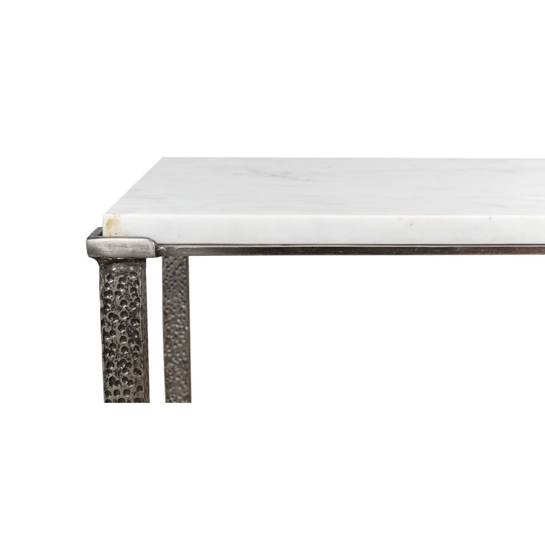 Close-up of console table corner and textured legs.
