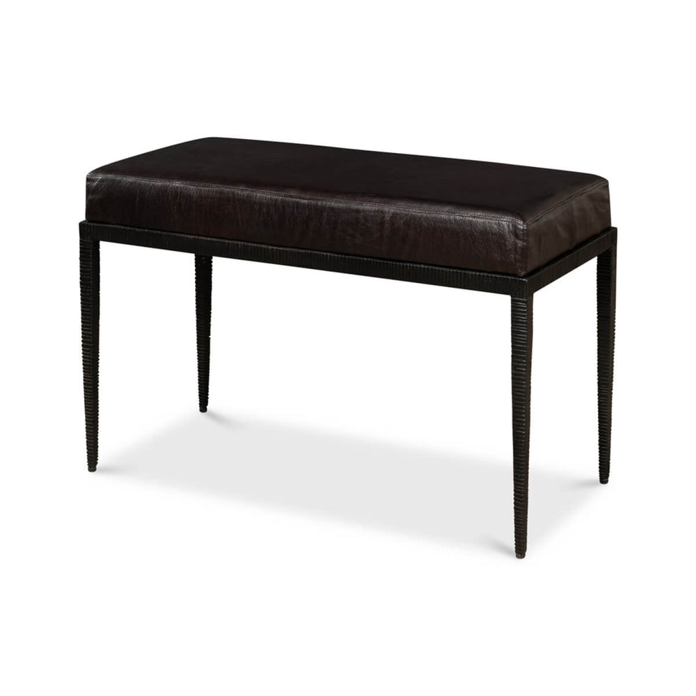 Black iron and leather bench, angled view.