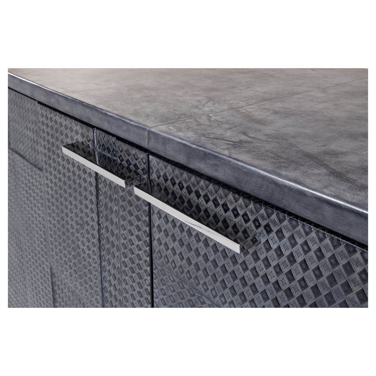 Detailed view of credenza handles on textured surface.