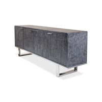 Side angle of leather credenza with metal legs.