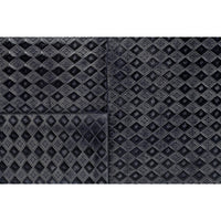Close-up of diamond-patterned leather texture.
