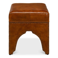Rear view of ottoman, showcasing leather and rivets.