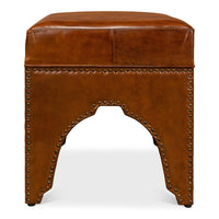 Front view of modern leather ottoman, rivet detailing.