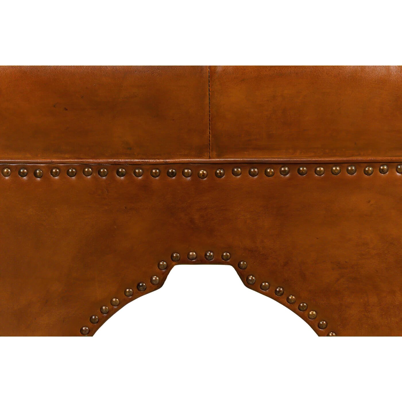Detailed close-up of ottoman base, rivet accents.