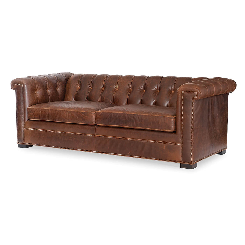 Brown leather Chesterfield sofa, angled front view
