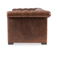 Brown leather Chesterfield sofa, side view