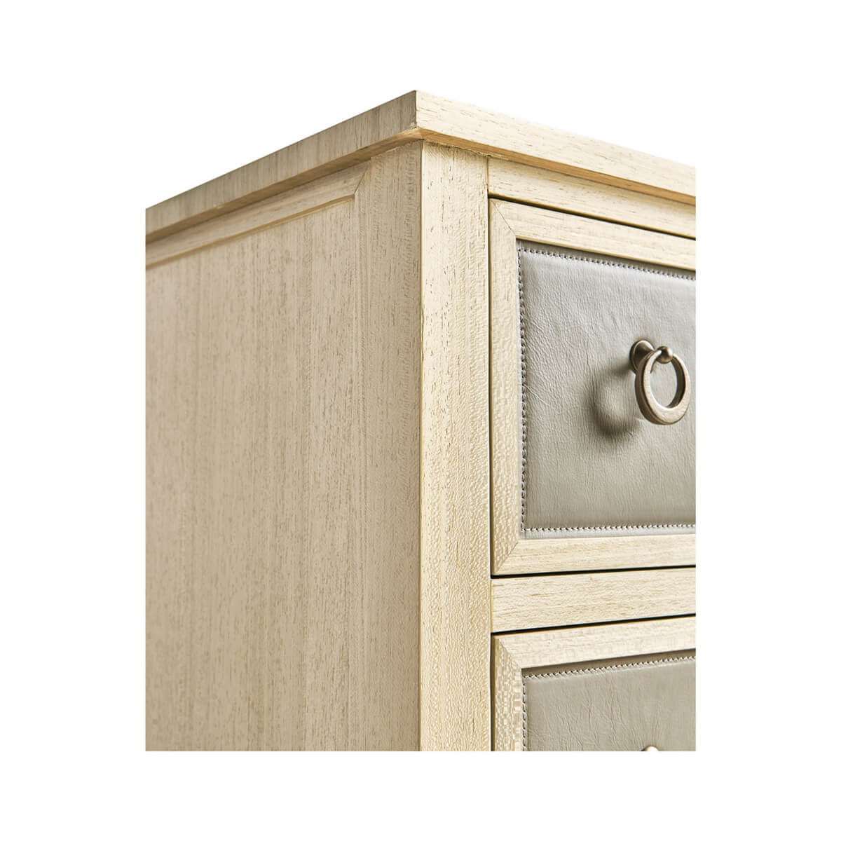 Side angle of leather chest of drawers.