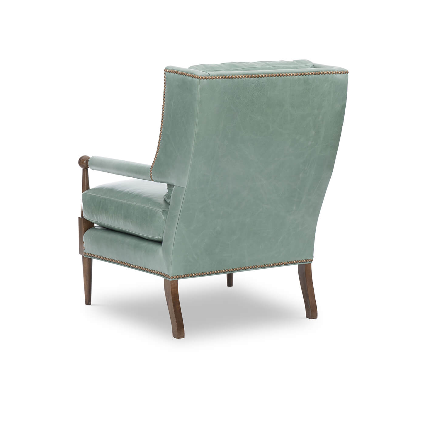 Back view of green leather armchair with wooden legs.