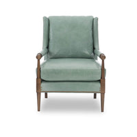 Front-facing green leather armchair with cushion detail.