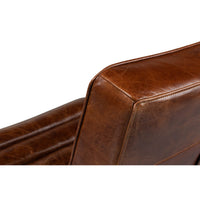 Close-up of leather finish on modern lounge chair.