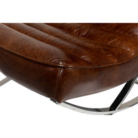Close-up seat detail of modern leather lounge chair.