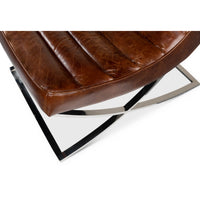 Chrome base detail of modern leather lounge chair.