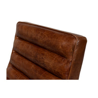 Upper section detail of modern leather lounge chair.