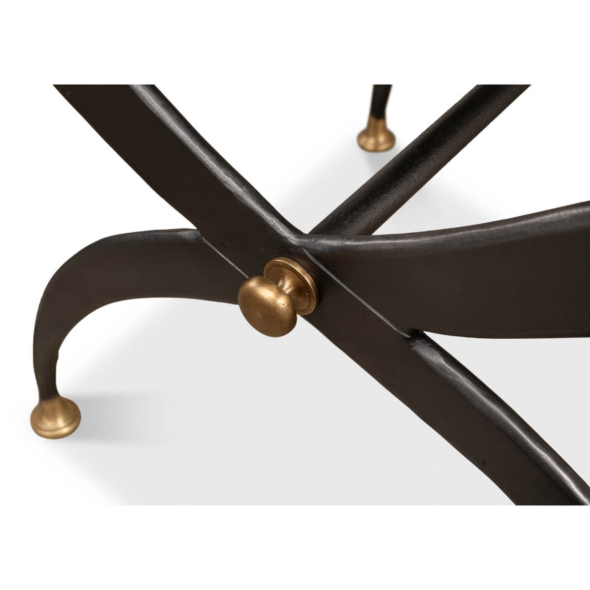 Close-up, stool leg with brass accent.