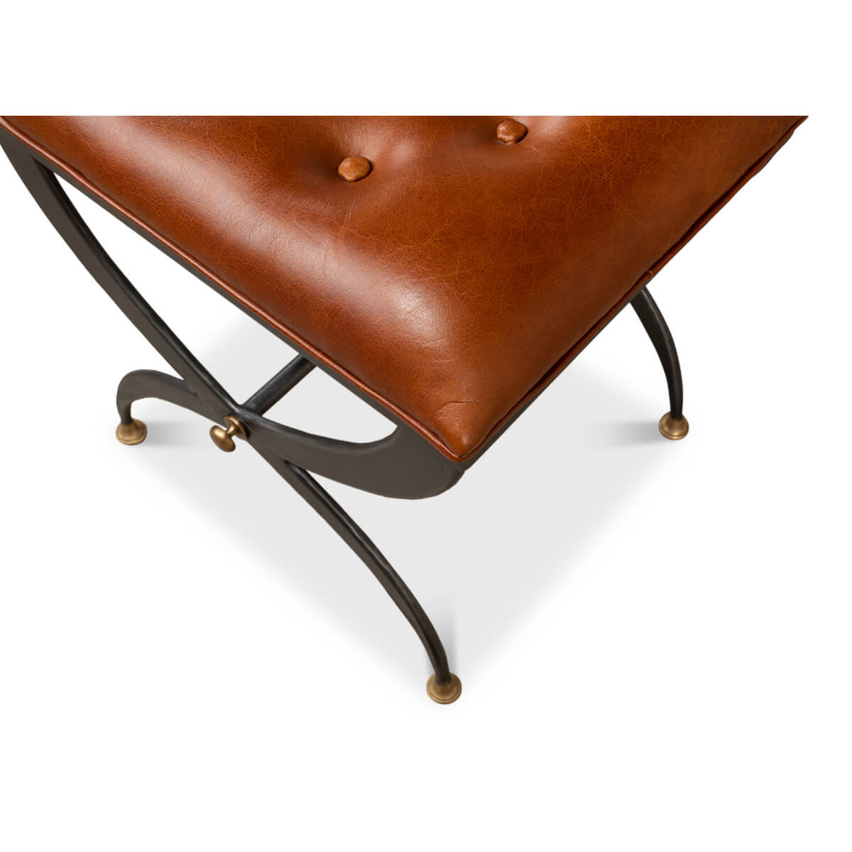 Top corner detail of stool, tufted leather visible.