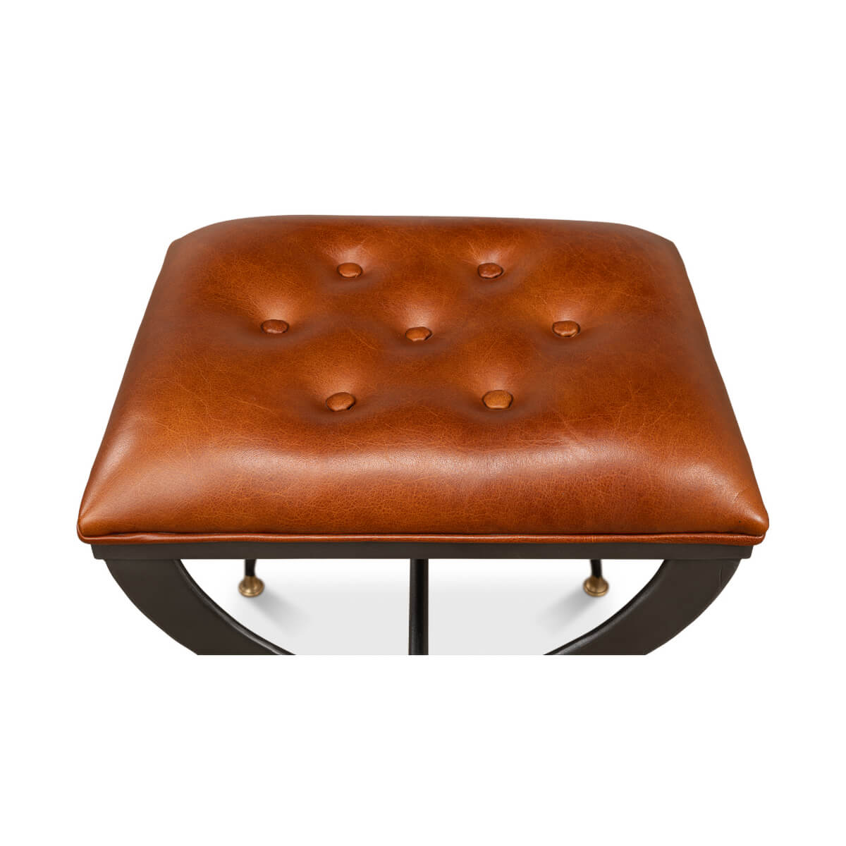 Top view of tufted leather seat on stool.