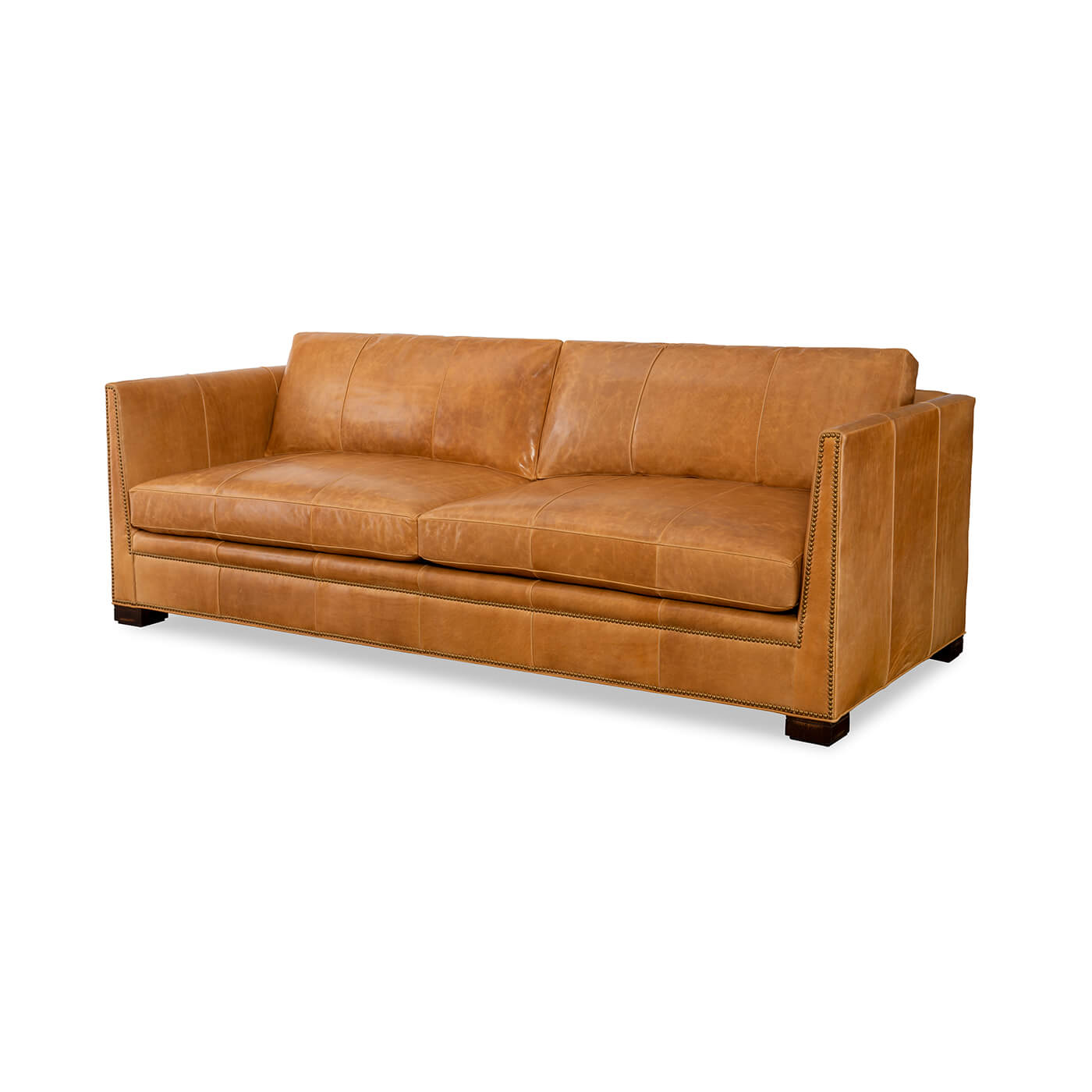 Tan leather sofa, perspective view, modern design.