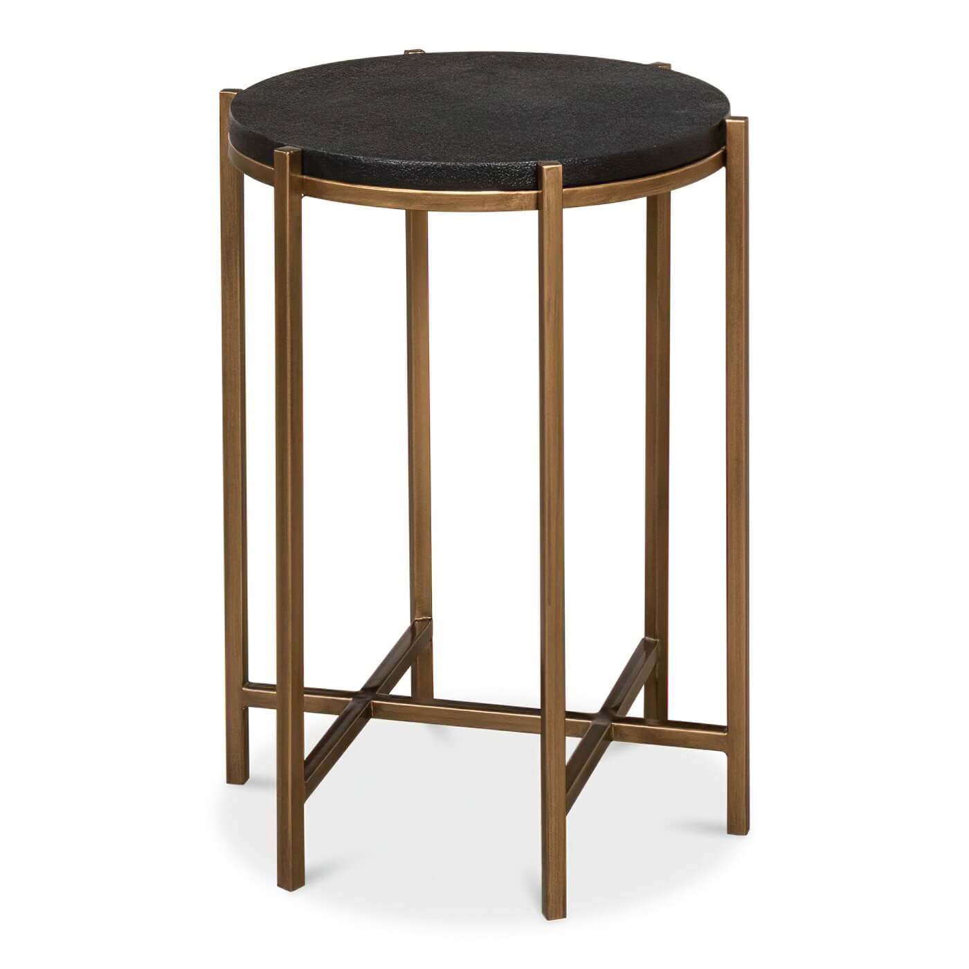 Round accent table with black leather top, gold frame.