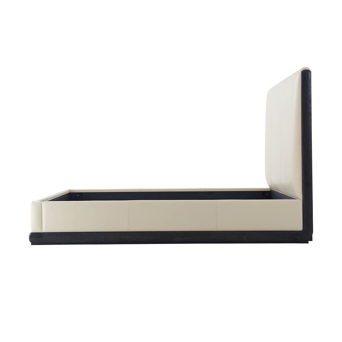 Side profile of modern leather upholstered king bed.