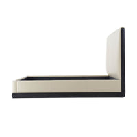 Side profile of modern leather upholstered king bed.