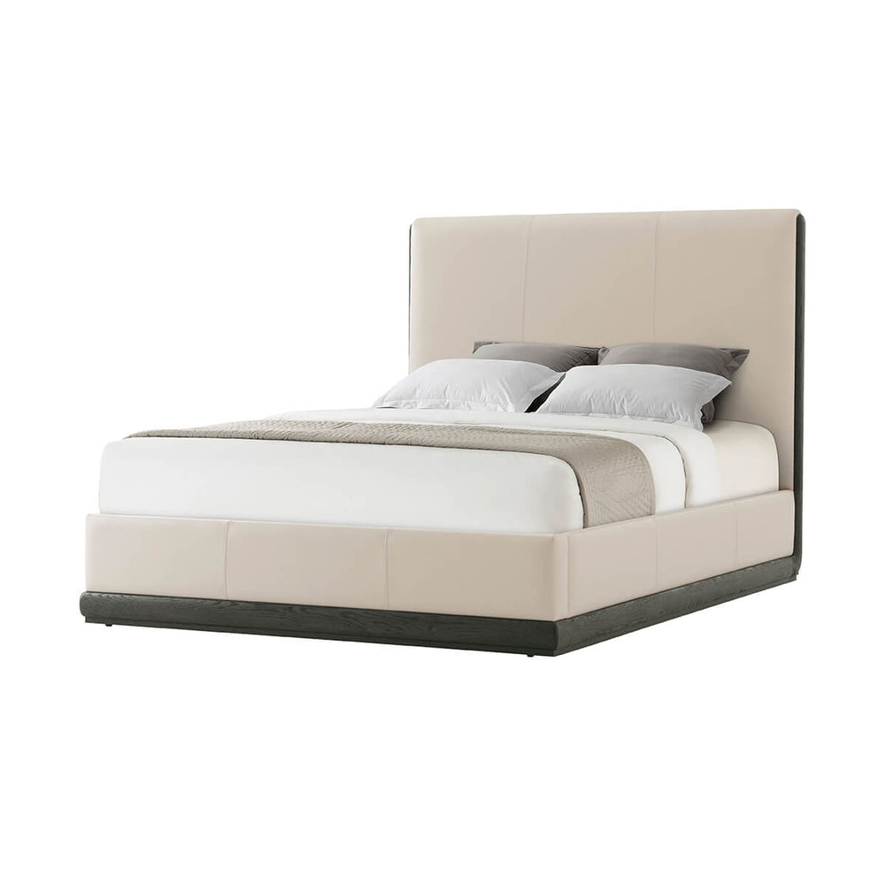 Modern leather upholstered queen bed with bedding, perspective view.
