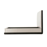 Side view of modern leather upholstered queen bed frame.