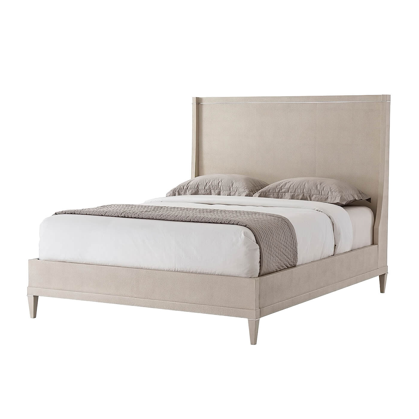 Beige modern leather bed with bedding, front view.
