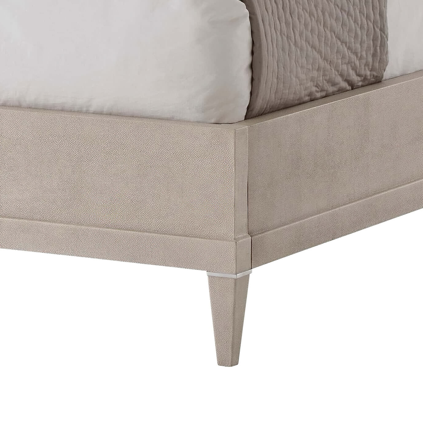 Bed corner and leg detail, beige modern leather bed.