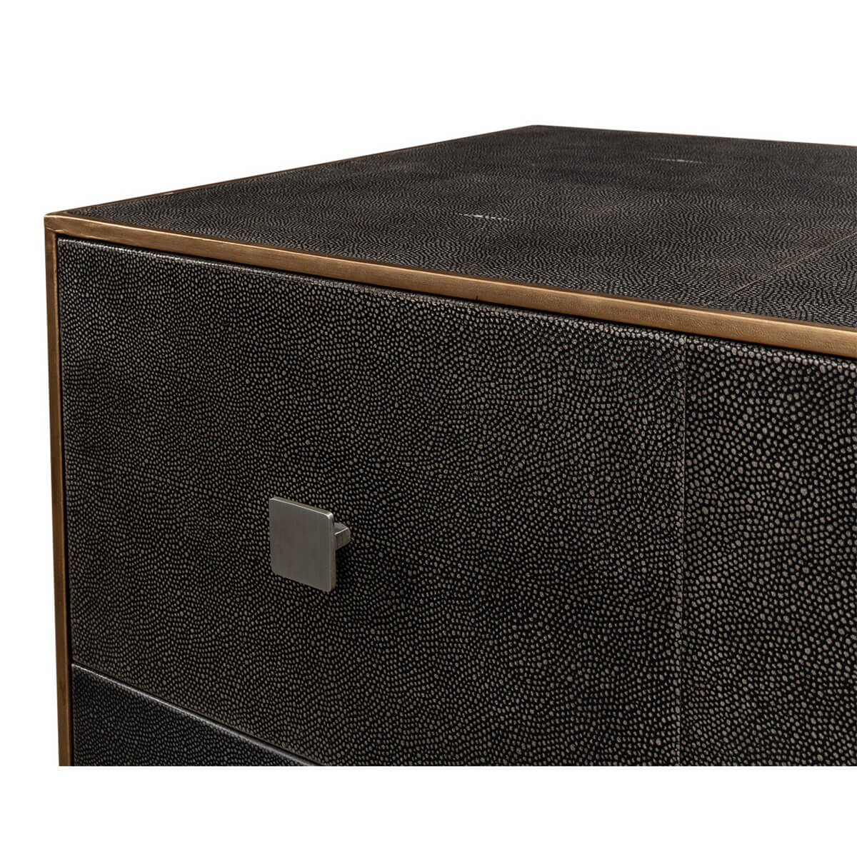 Close-up of dresser corner, textured leather and handle detail.