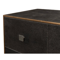 Close-up of dresser corner, textured leather and handle detail.