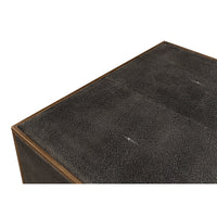 Close-up of dresser top, textured leather material detail.