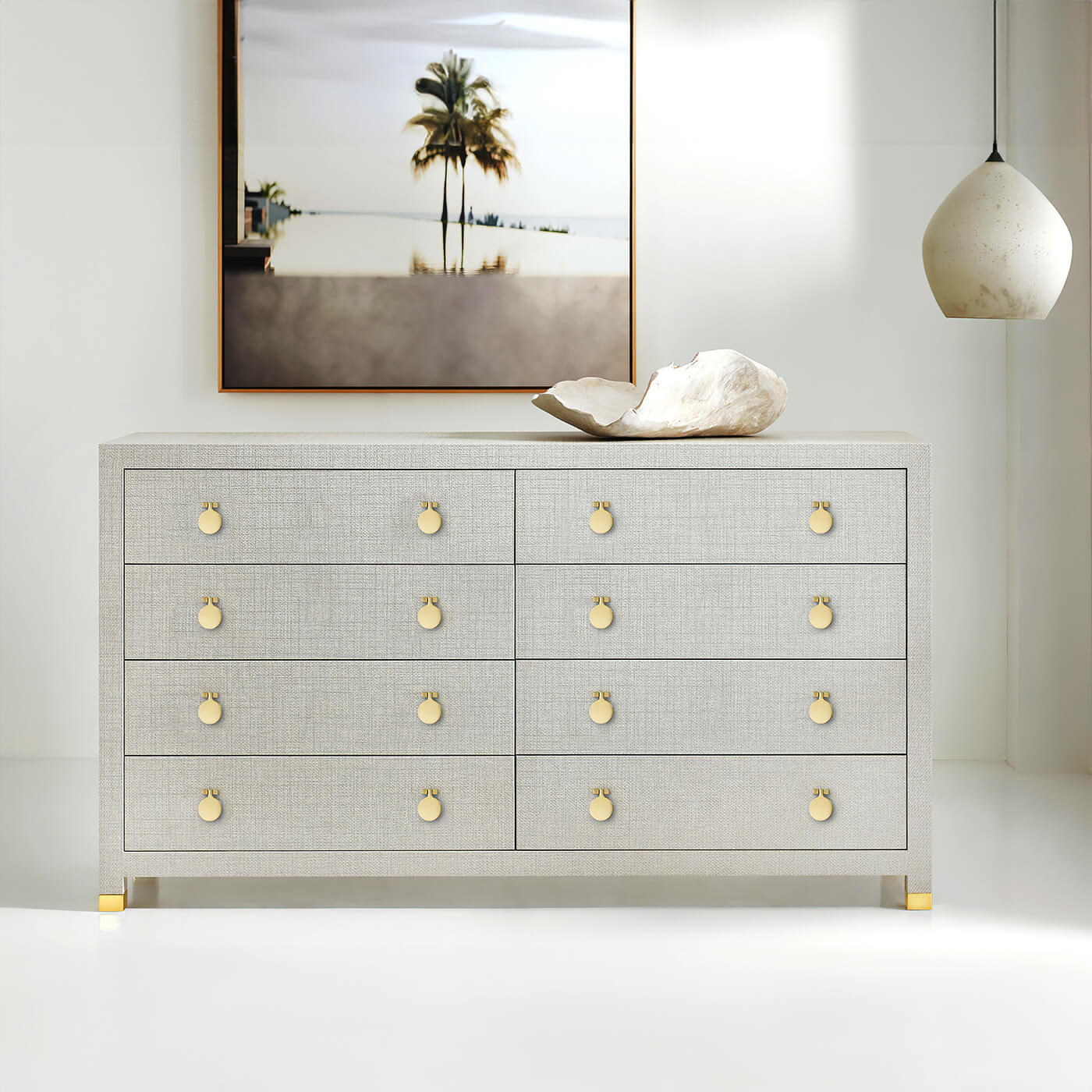 Modern dresser in room, with art and pendant light.