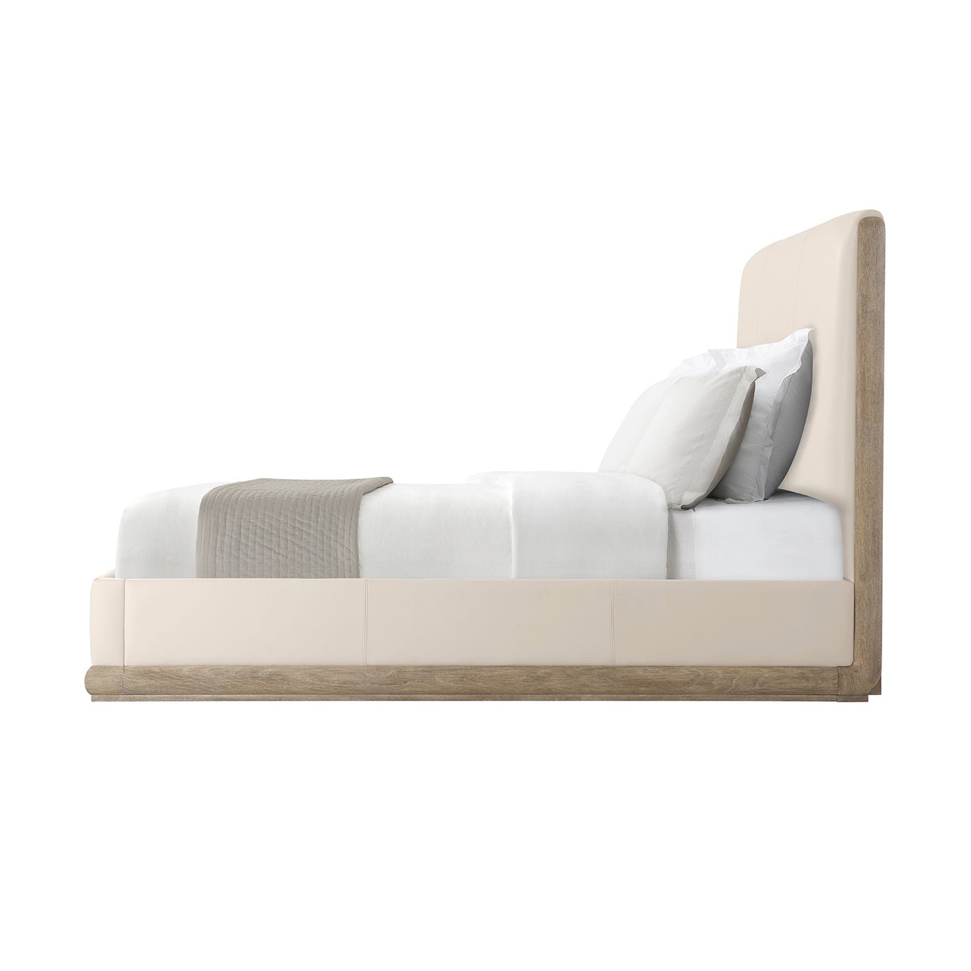 Side view of oak and leather upholstered bed.