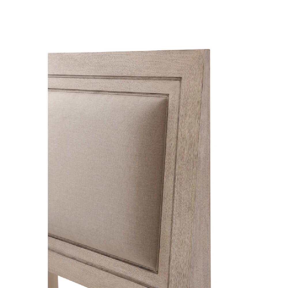 Angled view of modern light oak bed headboard.