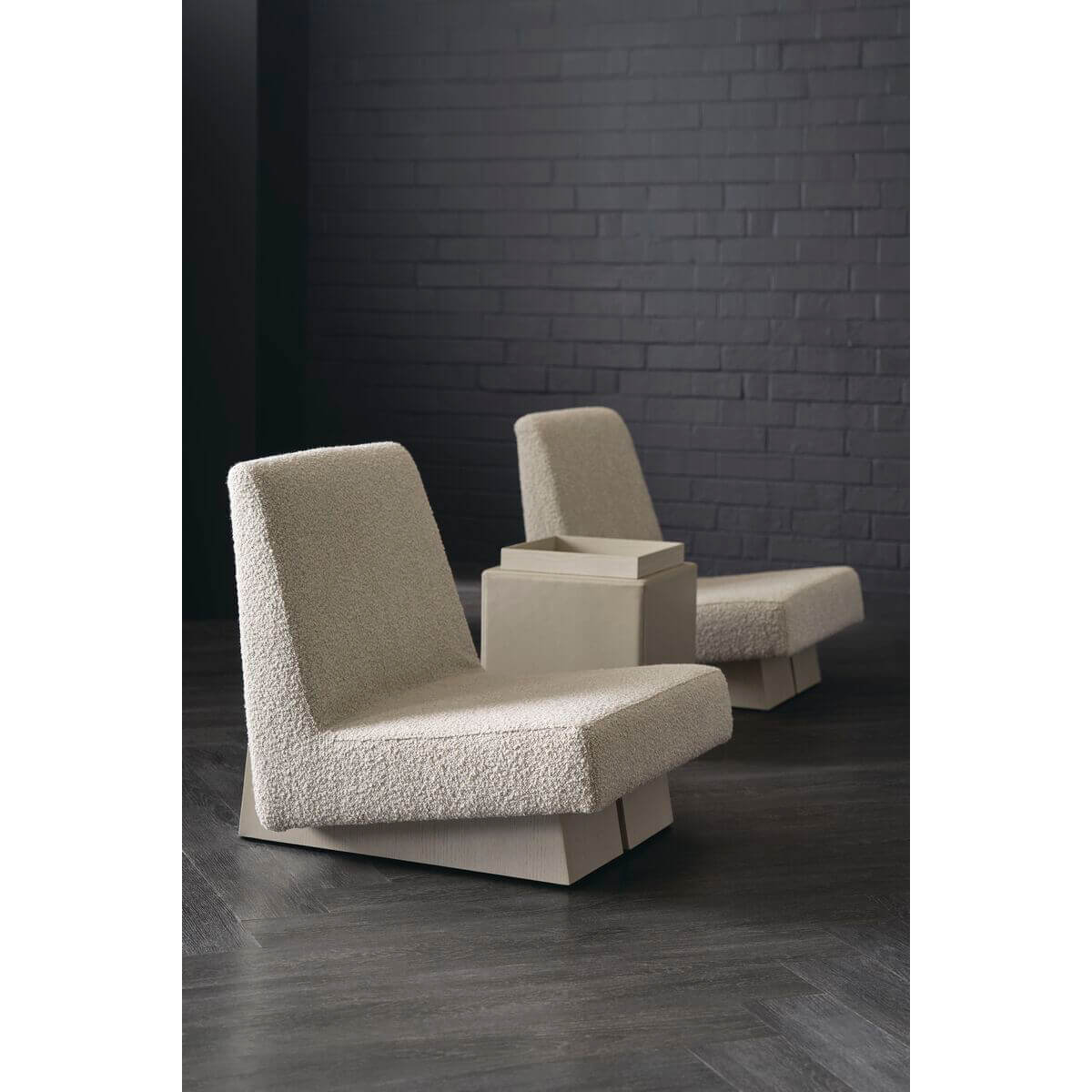 Pair of modern low accent chairs in indoor setting.