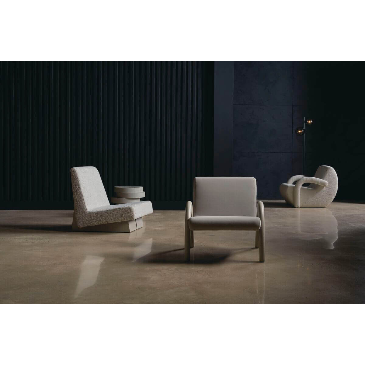Room setup showcasing modern low accent chairs and decor.