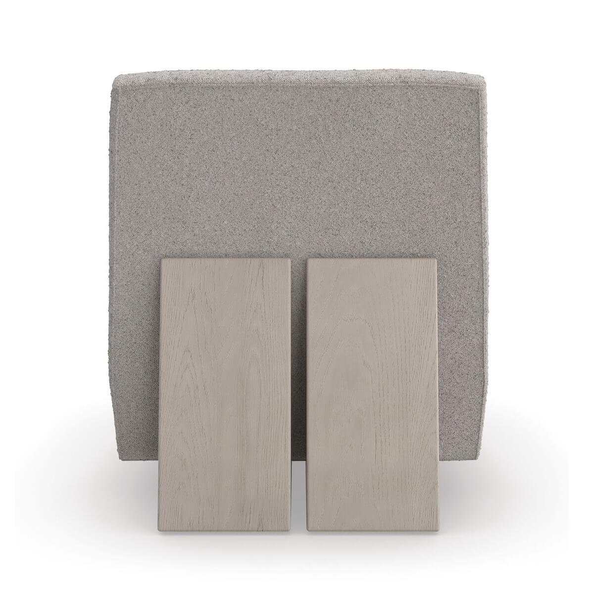 Rear view of modern low accent chair showing structure.