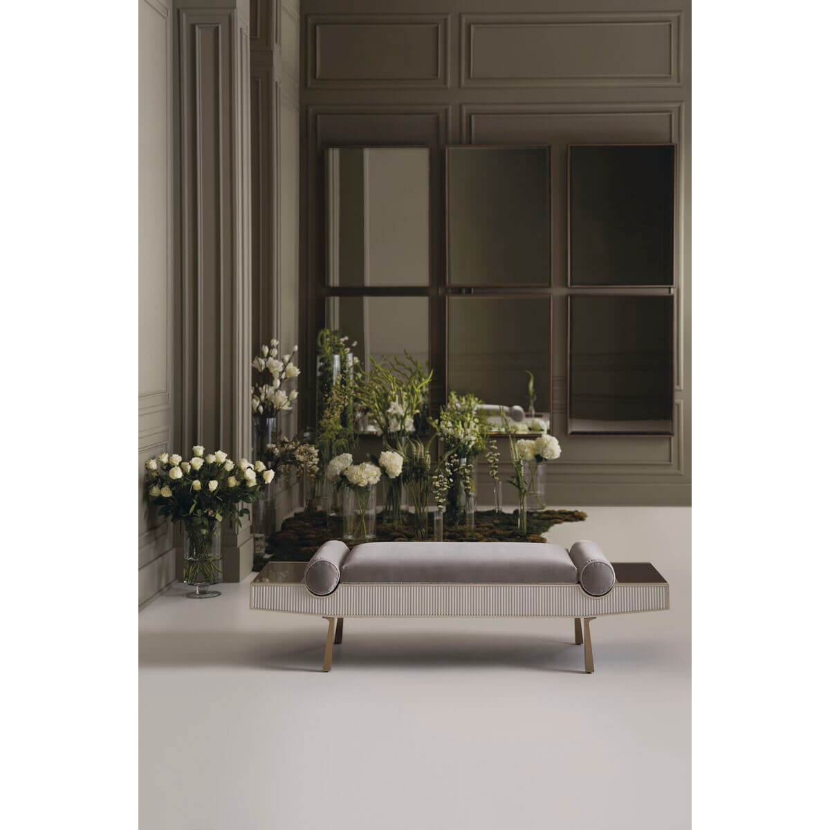 Modern luxury bench, sophisticated room, surrounded by flowers.