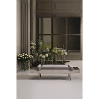 Modern luxury bench, sophisticated room, surrounded by flowers.