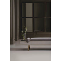 Modern luxury bench, elegant setting, dark room and plants.