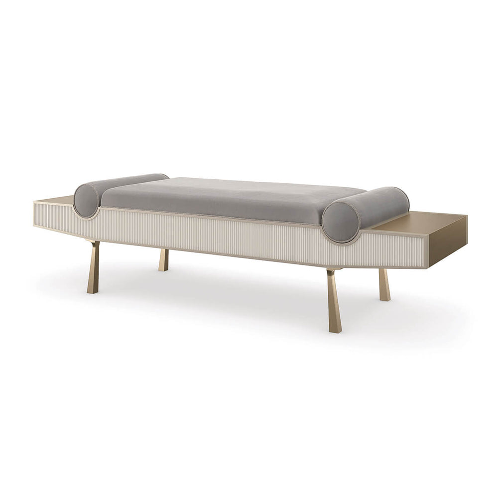 Modern luxury bench, angled side view, cylindrical pillows visible.