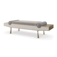 Modern luxury bench, angled side view, cylindrical pillows visible.