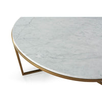 Close-up marble surface and gold frame cocktail table design.