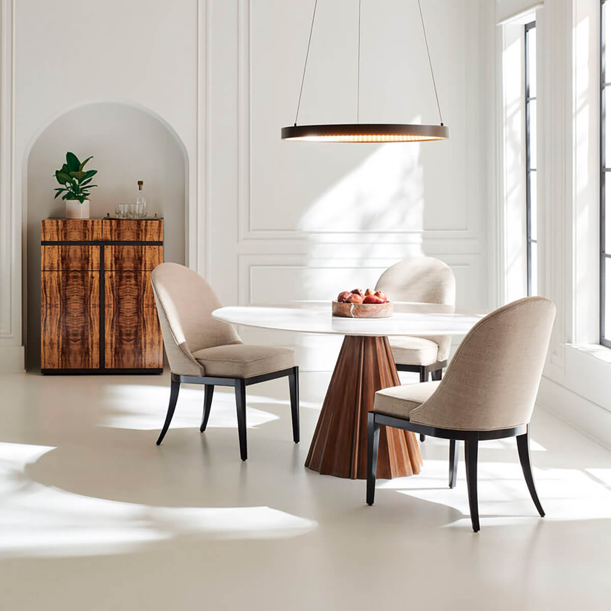 Dining table with chairs, modern interior setting.