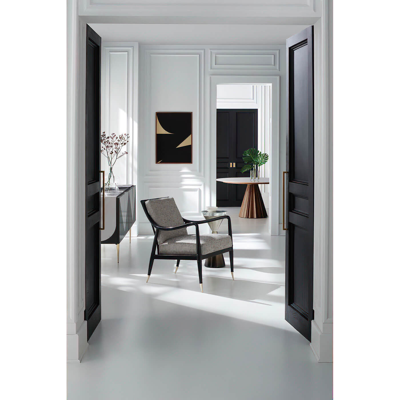 Dining table seen through open doors, modern decor.