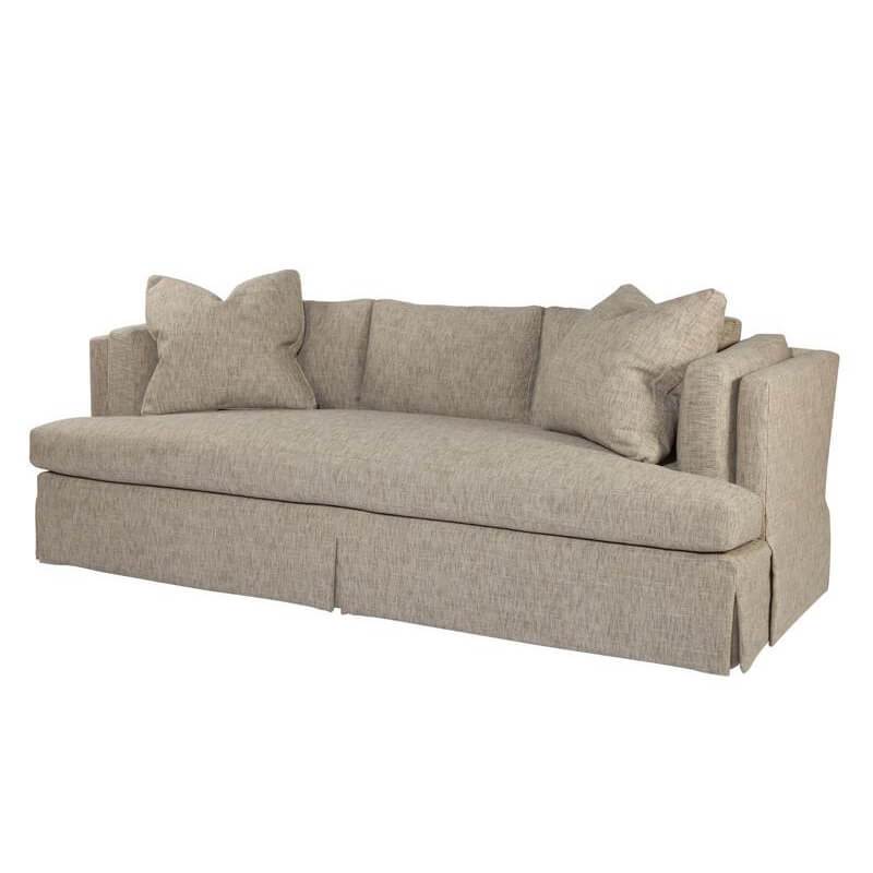 Beige upholstered sofa angled view with accent pillows