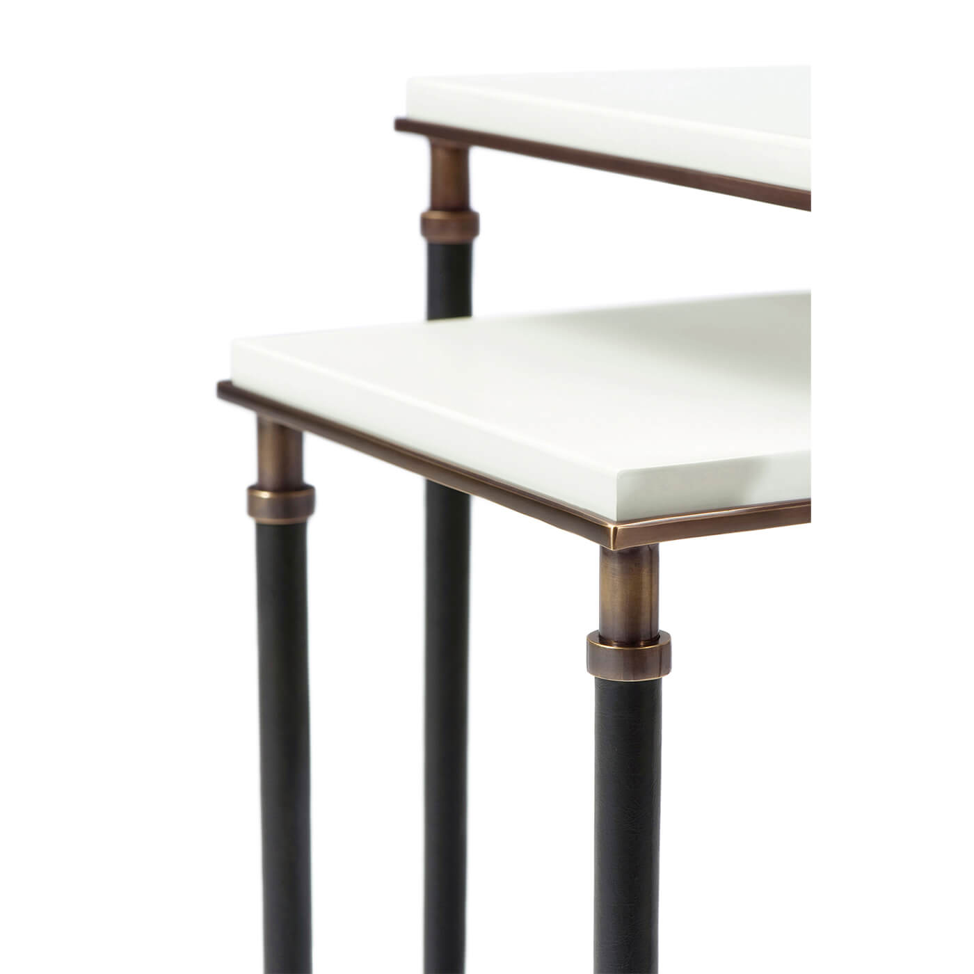 Close-up of modern table legs and white surface detail.