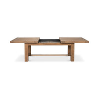 Oak dining table, open with extension leaf visible.