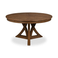 Round wooden dining table, unextended with pedestal base.